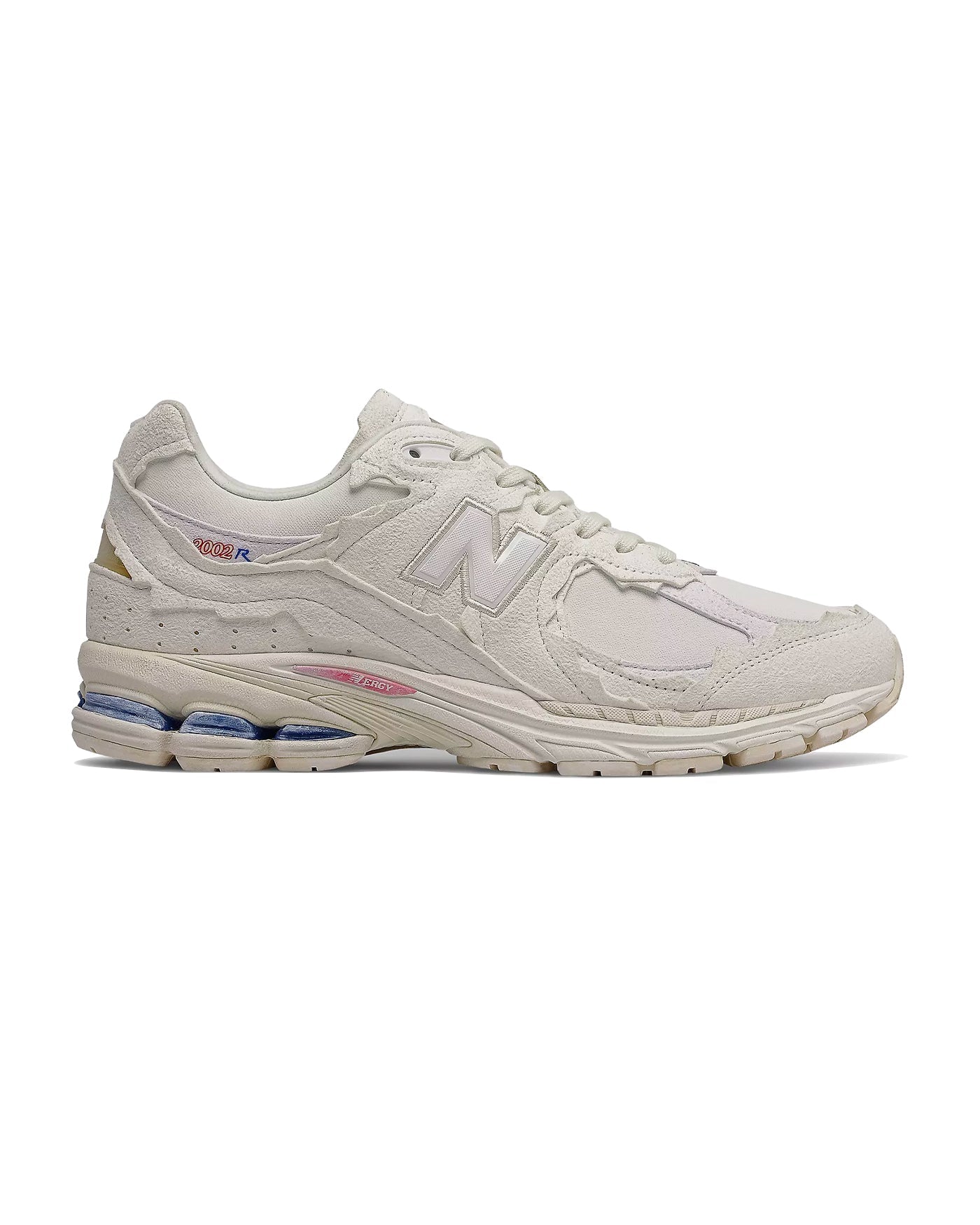 Sneakers New Balance 2002R blanc crème accents rose et bleu profil gauche