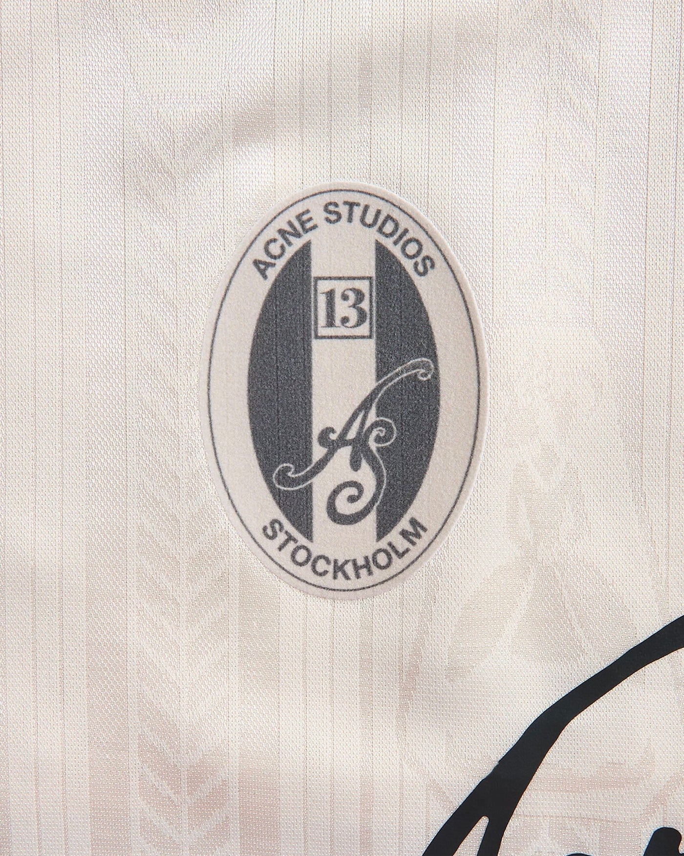 Jersey sport Acne Studios blanc cassé détail patch logo Stockholm