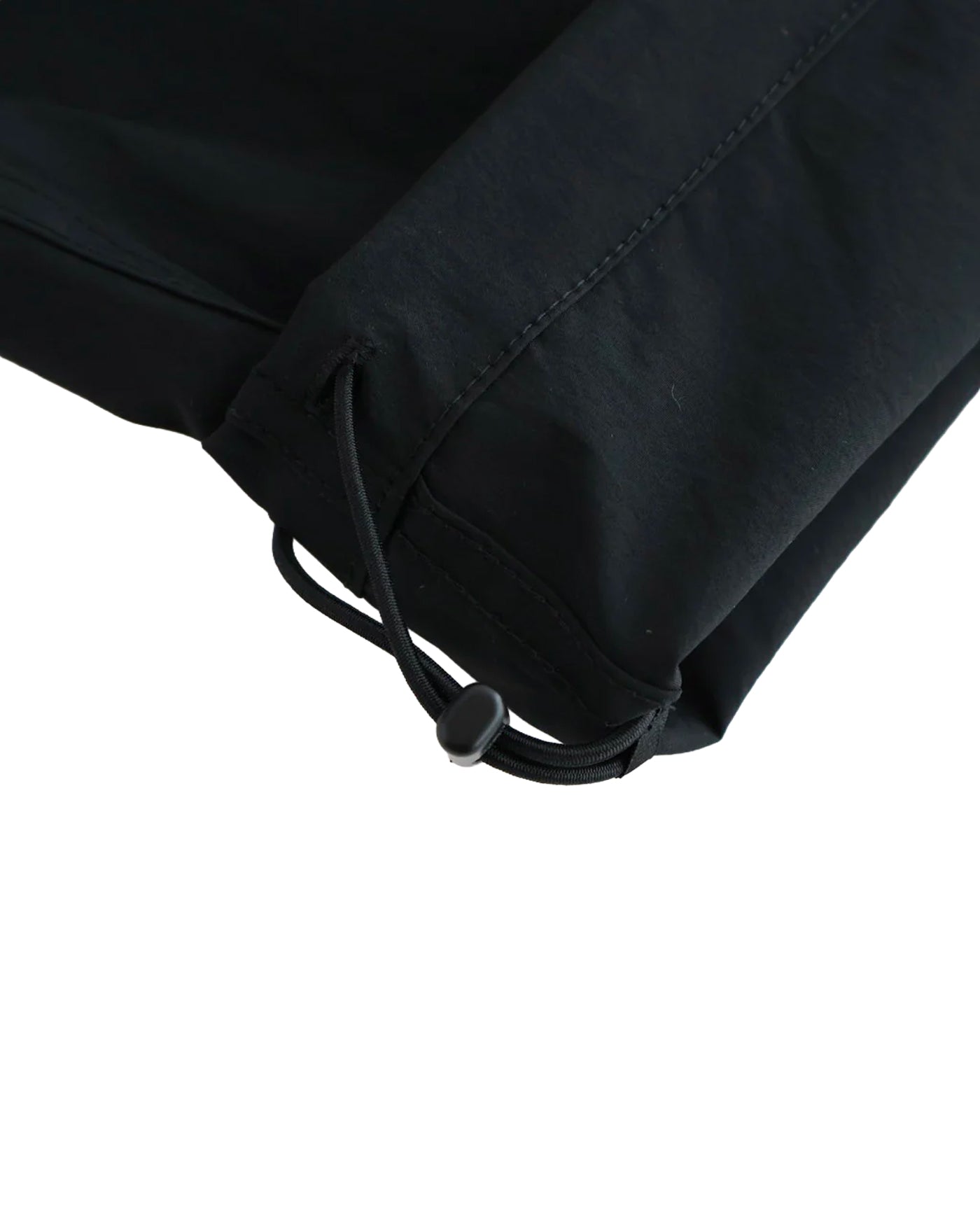 Pantalon Comme des Garçons Homme noir détail bas de jambe et revers